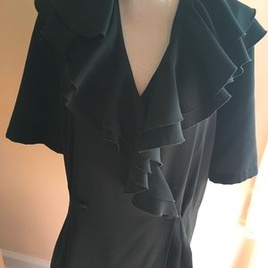 Black, Polly blouse. Double breasted button front. Ruffled collar.